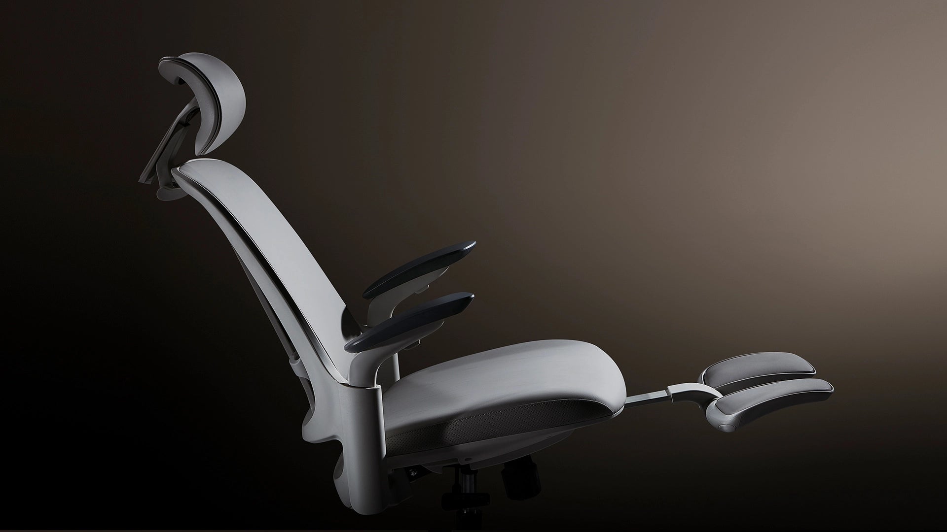 Sunaofe ergonomic white office chair featuring an adjustable headrest and extended footrest for maximum comfort.