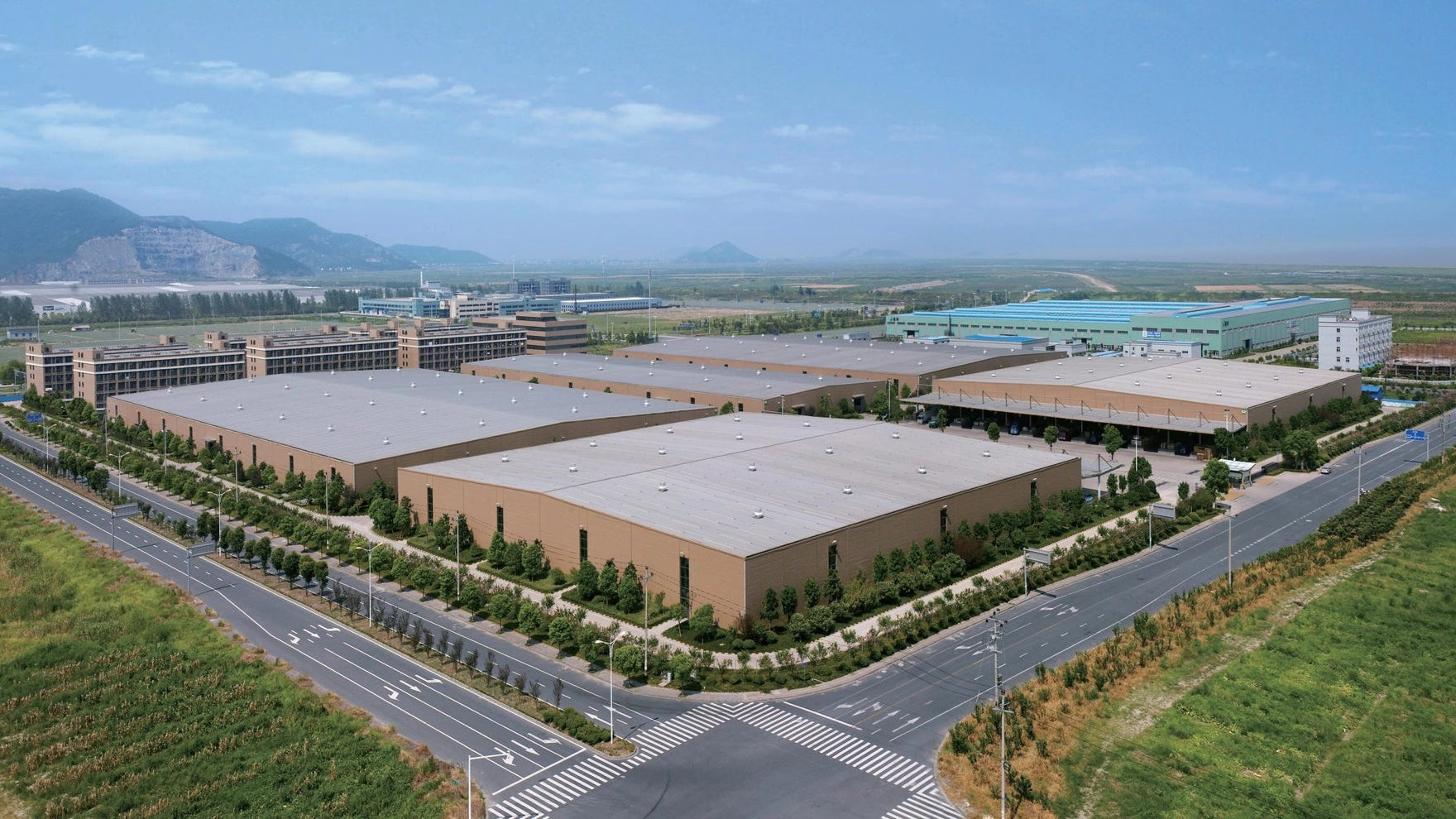 Aerial view of the Sunaofe manufacturing facility, showcasing its scale and commitment to production.