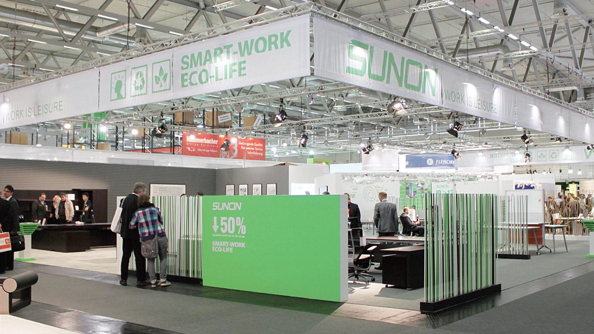 A Sunaofe trade show booth featuring eco-friendly designs and promoting smart work eco-life.