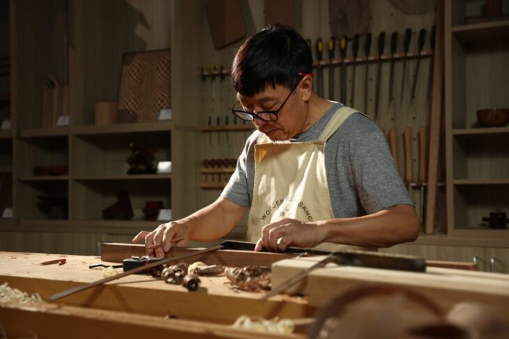 Man working with wood in a workshop