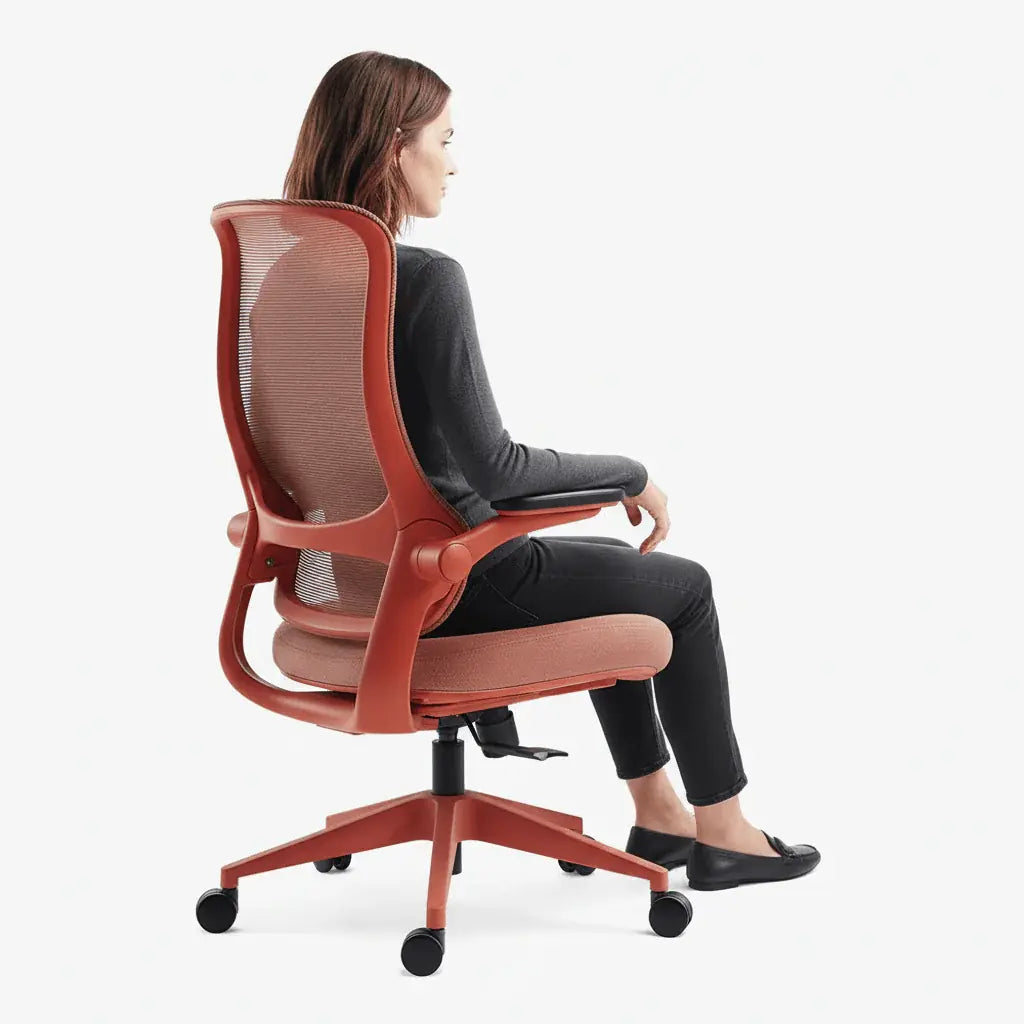 Woman sits in a red Sunaofe ergonomic office chair, promoting comfort and style.