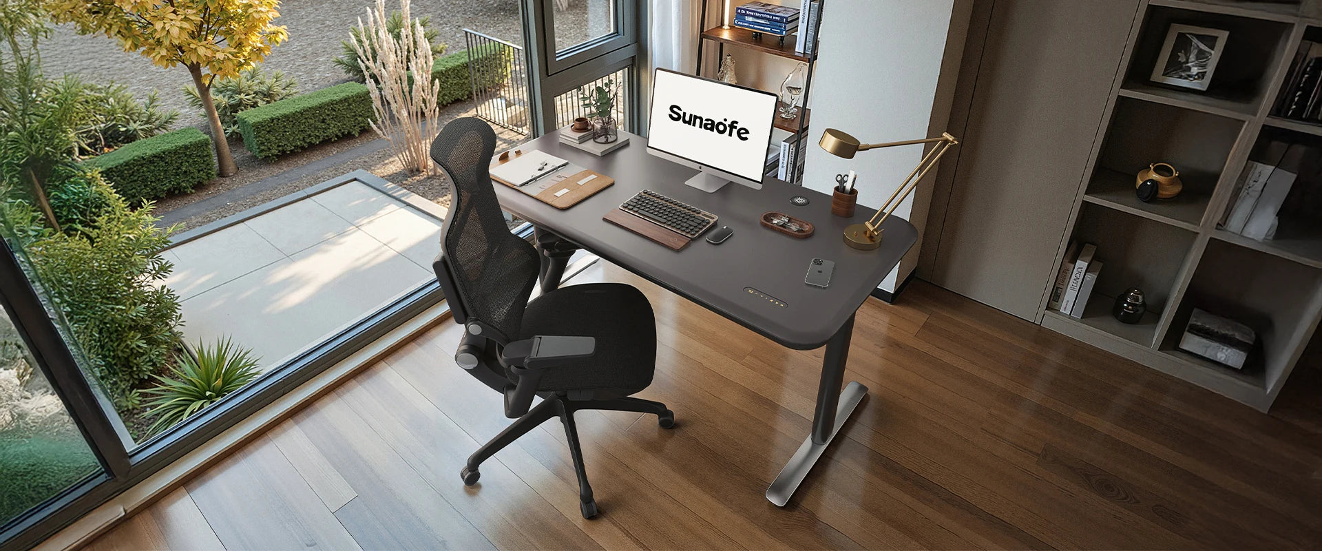 A Sunaofe height adjustable desk and ergonomic chair in a bright modern office space.